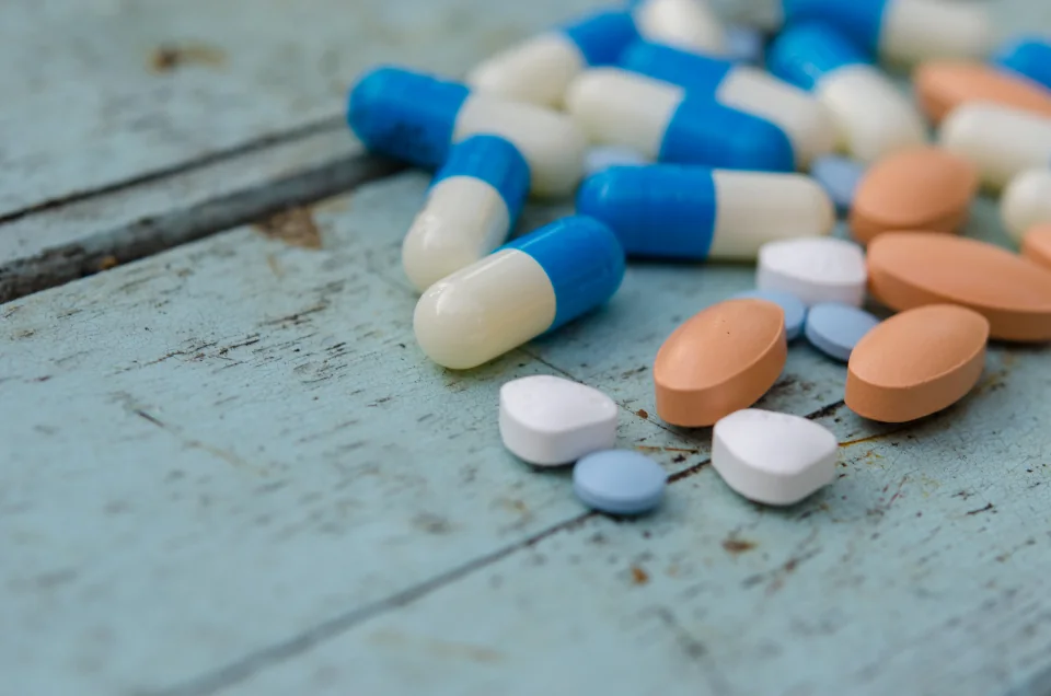 Close-up photograph of tablets and capsules.