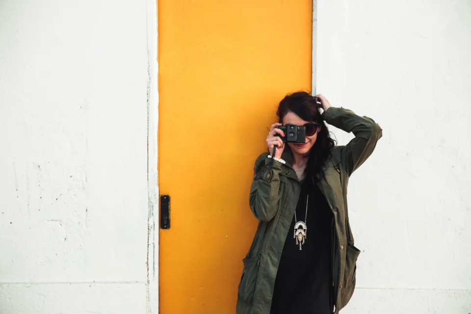 Photographer holding a camera to take a picture.